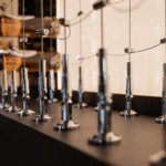 The cable rack's tension sets are mounted on a plywood base. In some other modern home wine rooms, the tension sets are mounted onto acrylic light panels.