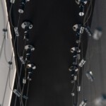 The black surface is a soffit that's attached to the ceiling. Cachet Wine Cellars recommended installing structural reinforcement to better stabilize the cables.