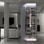 The beauty of Cachet Wine Cellar's cable racking is that light can pass through more freely throughout the collection. In this residential wine cellar,   the client opted to use light panels to hold the tension sets on both ends.