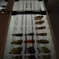 This cable racking column is not just for show, but to be a functional construction design to store wine bottles and access it easily. cable wine racking column design