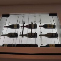 The three top shelves inside this cable wine cellar is designed for storing large bottles or for bottles that are not regularly used. upper cable racking shelf design and construction