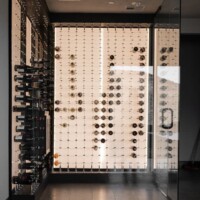 The LED panel and cable wine racks are a perfect combination for this wine cellar. Elegant Contemporary Lighting for Cable Wine Displays