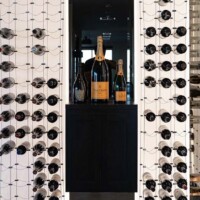 At front view, this wine cellar is a testament as to why Cable Wine Displays are truly experts at their craft. Modern Minimalist Home Wine Cellar With Cable Racking and LED Panels thumbnail