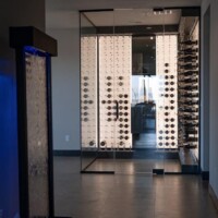 The glass doors allows the cable wine cellar showcase the wine bottles beautifully. modern cable racking by Cable Wine Displays