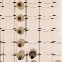 The LED panel lighting makes the cable wine display look even more luxurious. simple but modern cable wine racking display system